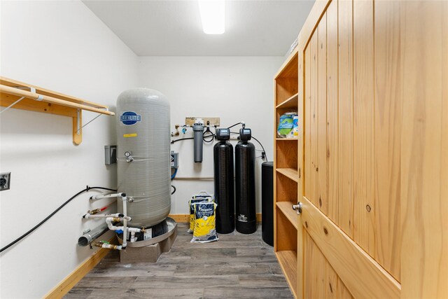 interior space with washer hookup, wood-type flooring, and electric dryer hookup