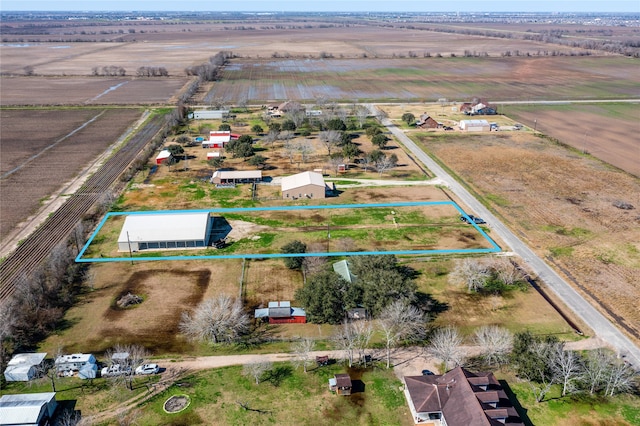 birds eye view of property with a rural view