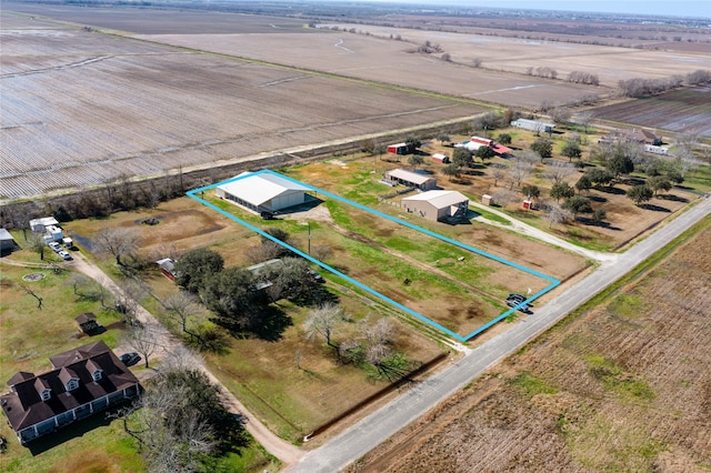 birds eye view of property with a rural view