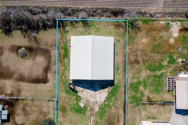 birds eye view of property with a rural view