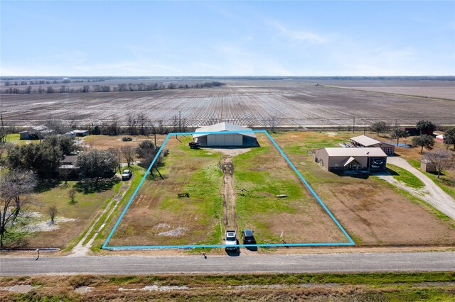 birds eye view of property featuring a rural view