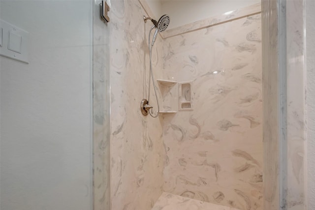 room details featuring a tile shower