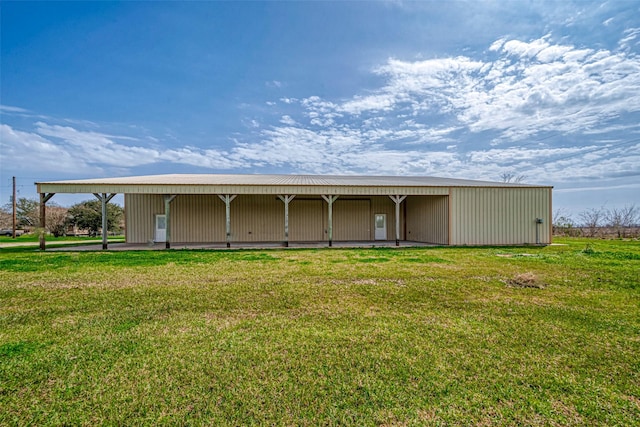 view of outdoor structure with a lawn