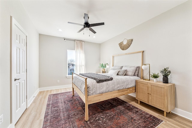 bedroom featuring ceiling fan and light hardwood / wood-style floors