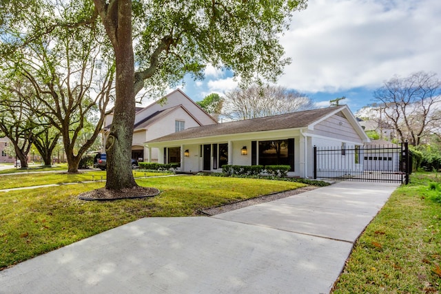 view of front of home with a garage and a front lawn