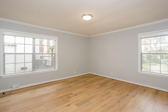 unfurnished room featuring crown molding and light hardwood / wood-style flooring