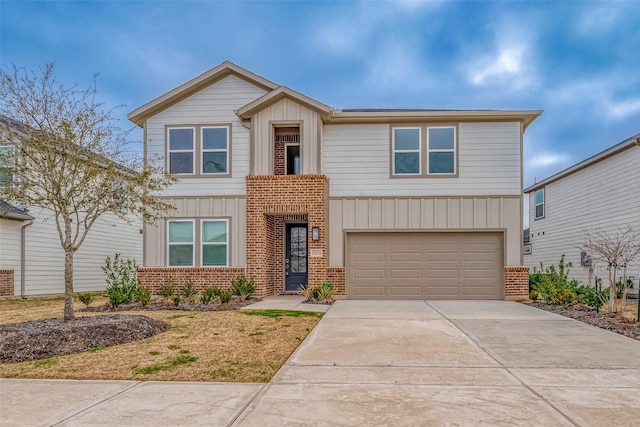 view of front of house featuring concrete driveway, brick siding, board and batten siding, and an attached garage