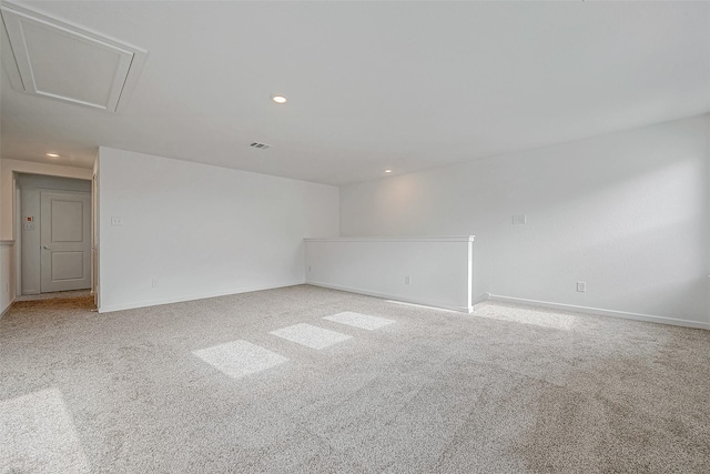 spare room featuring recessed lighting, visible vents, baseboards, and light colored carpet