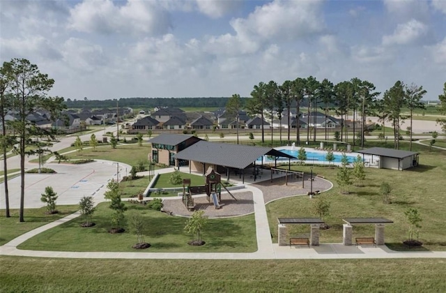 surrounding community featuring a residential view and a lawn