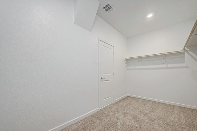 walk in closet featuring carpet floors and visible vents