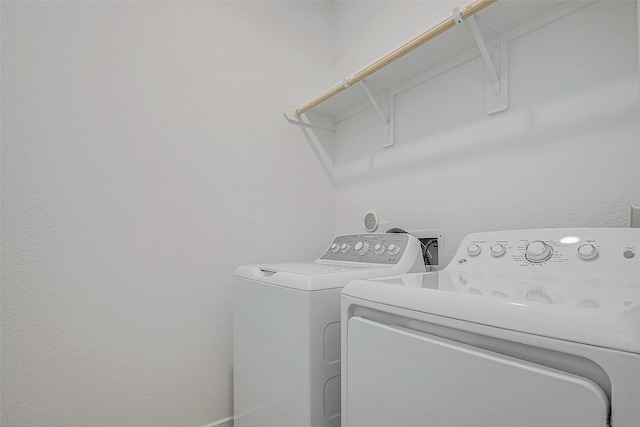 clothes washing area featuring laundry area and independent washer and dryer