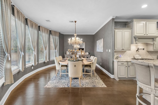 dining room with dark wood-style flooring, crown molding, visible vents, an inviting chandelier, and baseboards