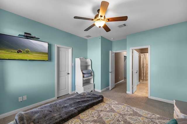 bedroom with light colored carpet, visible vents, ceiling fan, and baseboards