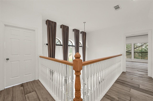 hall with wood-type flooring