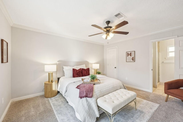 bedroom with crown molding, ceiling fan, connected bathroom, and light carpet