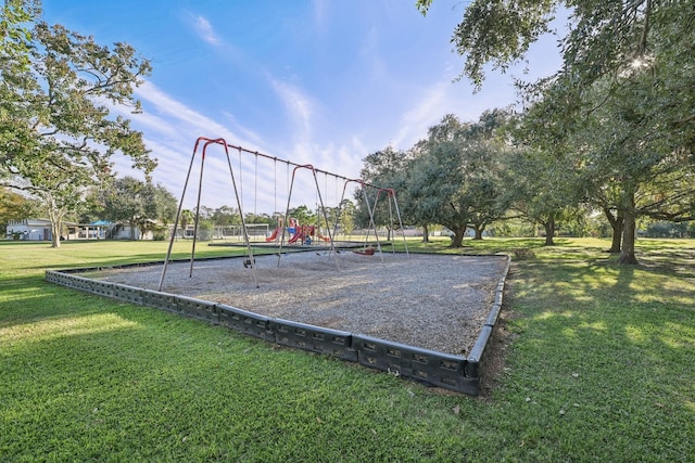 surrounding community with a playground and a lawn