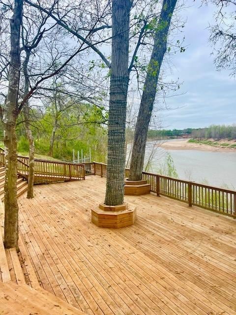 wooden deck featuring a water view