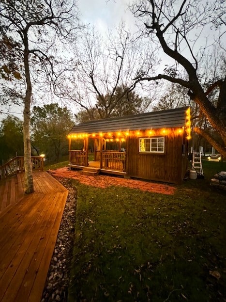 back of house with a wooden deck