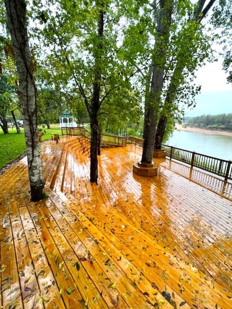 wooden terrace with a water view