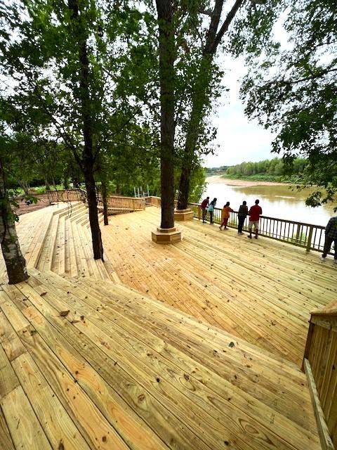 wooden deck featuring a water view