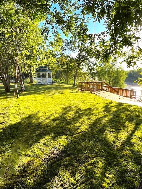 view of yard featuring a gazebo and a deck