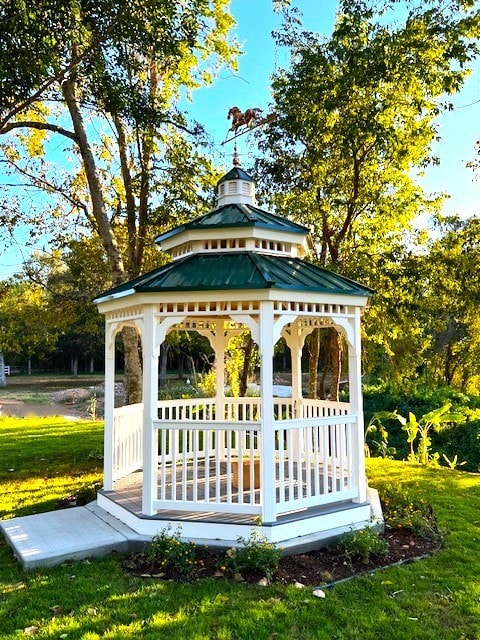 view of home's community with a gazebo and a lawn