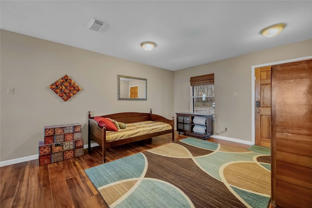 bedroom featuring hardwood / wood-style floors