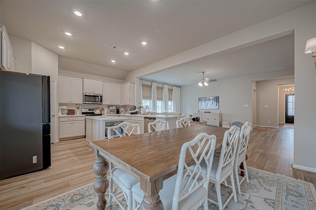 dining area with a ceiling fan, visible vents, baseboards, light wood-style floors, and recessed lighting