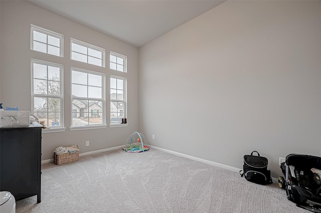game room featuring carpet floors and baseboards