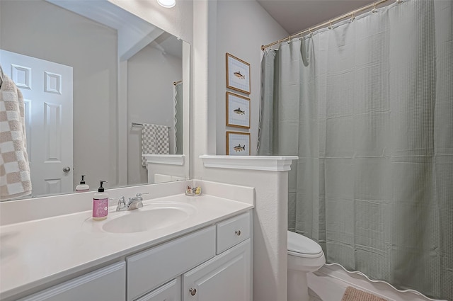 bathroom featuring vanity, a shower with curtain, and toilet