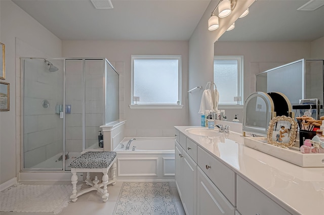 full bathroom featuring vanity, visible vents, tile patterned floors, a bath, and a shower stall