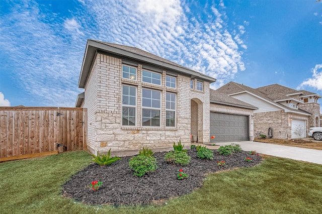traditional home with a garage, a front lawn, fence, stone siding, and driveway