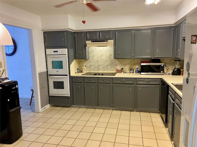 kitchen with backsplash, ceiling fan, light tile patterned floors, and black appliances