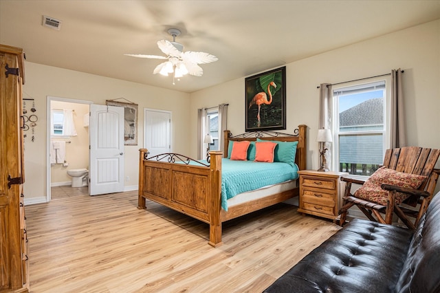 bedroom featuring light hardwood / wood-style floors, connected bathroom, and ceiling fan