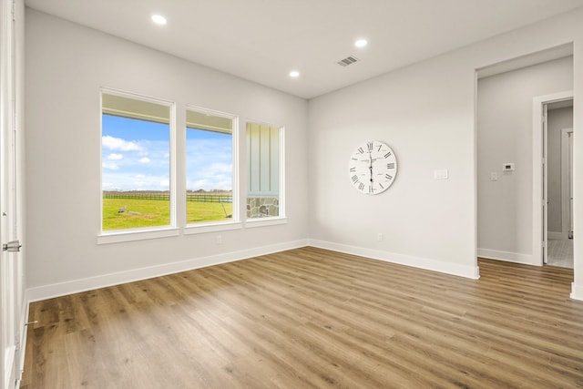 unfurnished room featuring wood-type flooring