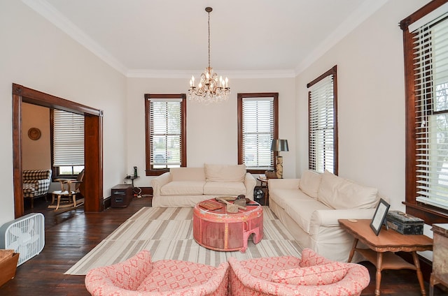 living room with ornamental molding, dark hardwood / wood-style flooring, and a chandelier