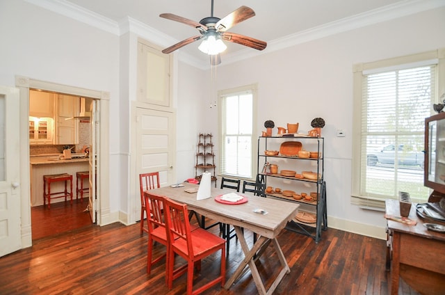 dining space with dark wood-type flooring, ornamental molding, ceiling fan, and plenty of natural light