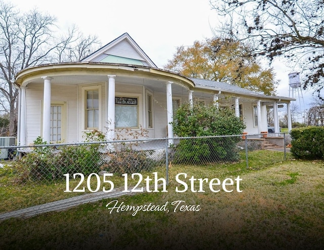 1205 12th St, Hempstead, TX 77445 - farmhouse inspired home with central AC unit and covered porch