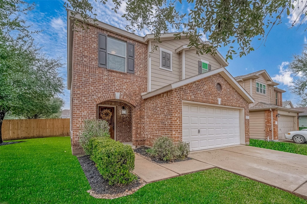 view of front facade with a garage and a front yard