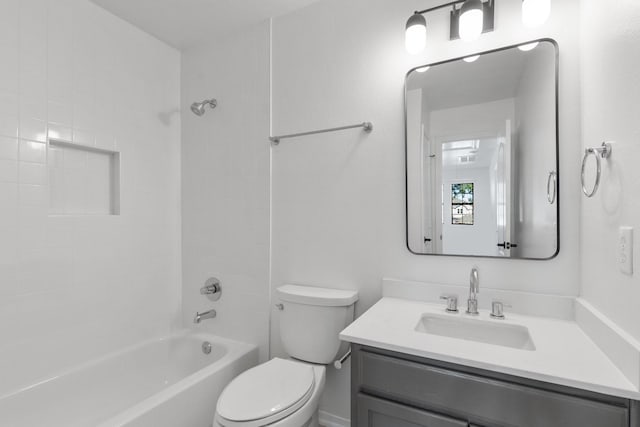 full bathroom featuring vanity, toilet, and tiled shower / bath