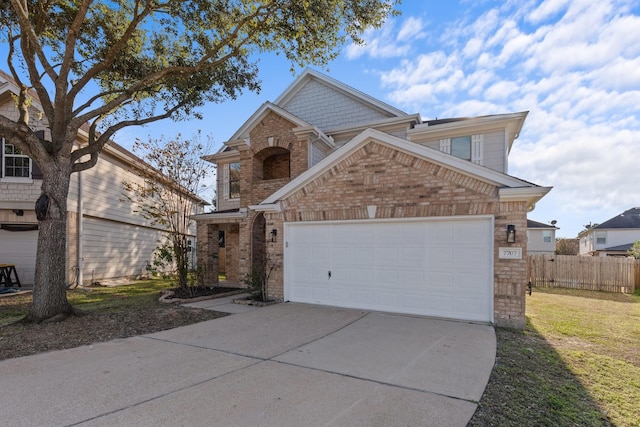 view of front of home with a garage and a front yard