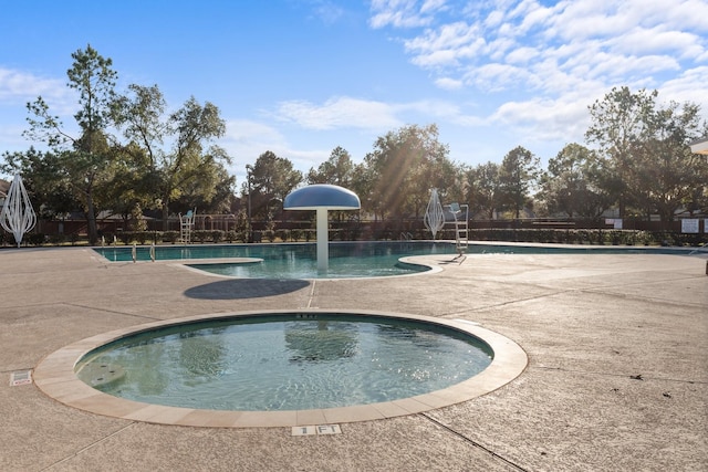 view of swimming pool with a patio