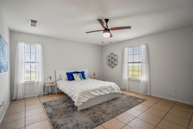 bedroom featuring ceiling fan and light tile patterned floors