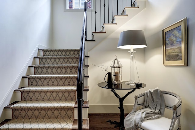 stairs with wood-type flooring