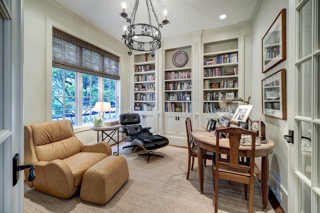 living area featuring a notable chandelier, ornamental molding, and built in features