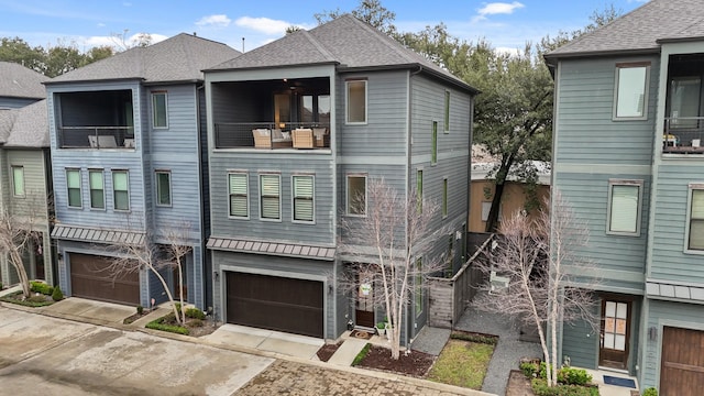 view of front of house featuring a balcony