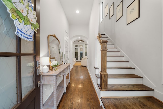 entryway with dark hardwood / wood-style flooring