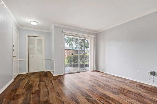 unfurnished room featuring dark hardwood / wood-style flooring and crown molding