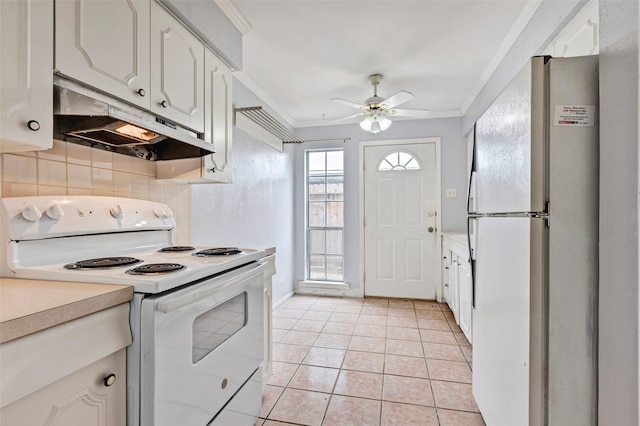 kitchen with white cabinetry, light tile patterned floors, ornamental molding, white appliances, and decorative backsplash