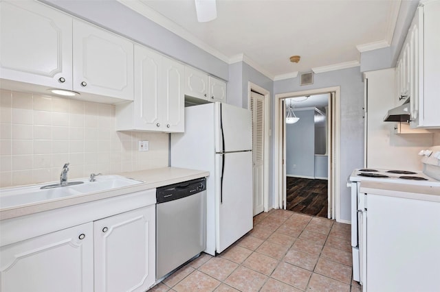 kitchen with light tile patterned floors, crown molding, white appliances, backsplash, and white cabinets